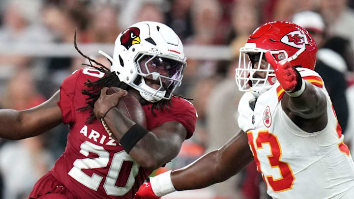 Arizona Cardinals running back DeeJay Dallas (20) tries to juke past Kansas City Chiefs defensive tackle Coziah Izzard (93) during their preseason game at State Farm Stadium on Aug. 9, 2025. Arizona Cardinals running back DeeJay Dallas (20) tries to juke past Kansas City Chiefs defensive tackle Coziah Izzard (93) during their preseason game at State Farm Stadium on Aug. 9, 2025.