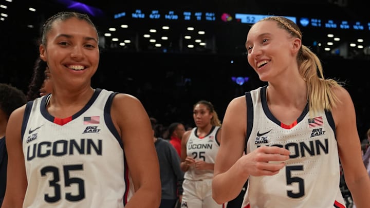 Dec 7, 2024; Brooklyn, New York, USA; Connecticut Huskies guard Azzi Fudd (35) and Connecticut Huskies guard Paige Bueckers (5) celebrate after the game against the Louisville Cardinals at Barclays Center. Mandatory Credit: Lucas Boland-Imagn Images Dec 7, 2024; Brooklyn, New York, USA; Connecticut Huskies guard Azzi Fudd (35) and Connecticut Huskies guard Paige Bueckers (5) celebrate after the game against the Louisville Cardinals at Barclays Center. Mandatory Credit: Lucas Boland-Imagn Images