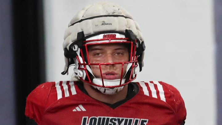 Louisville’s Ashton Gillotte warms up for Spring Practice on Thursday.
April 4, 2024