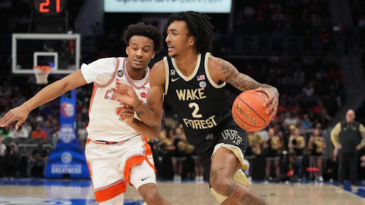 Mar 11, 2026; Charlotte, NC, USA; Wake Forest Demon Deacons forward Juke Harris (2) with the ball as Clemson Tigers guard Efrem Johnson (4) defends in the first half at Spectrum Center. Mandatory Credit: Bob Donnan-Imagn Images