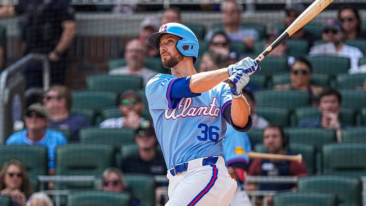 Jul 18, 2026; Cumberland, Georgia, USA; Atlanta Braves right fielder Eli White (36) hits a home run against the Texas Rangers during the second inning at Truist Park. Mandatory Credit: Dale Zanine-Imagn Images