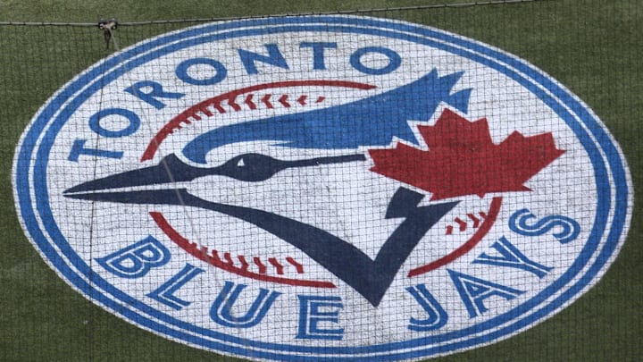 The Toronto Blue Jays logo can be seen embedded on the turf behind home plate. The Toronto Blue Jays logo can be seen embedded on the turf behind home plate.