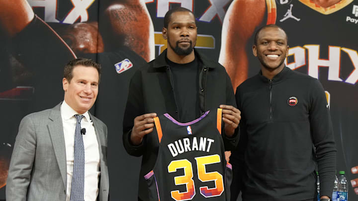 Phoenix Suns owner Mat Ishbia, Kevin Durant and former general manager James Jones pose for a photo at Footprint Center.
