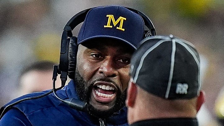 Michigan head coach Sherrone Moore talks to a referee and challenges an incomplete pass intended for tight end Colston Loveland (not in the photo) during the second half against Oregon at Michigan Stadium in Ann Arbor on Saturday, Nov. 2, 2024.