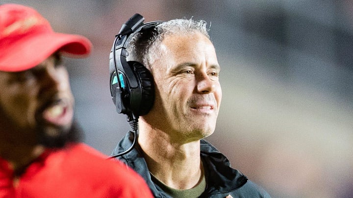 Florida State Seminoles head coach Mike Norvell smiles after his players score a touchdown. The Florida State Seminoles defeated the Miami Hurricanes 27-20 on Saturday, Nov. 11, 2023.