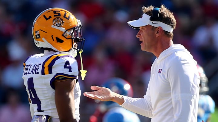 Mississippi Rebels head coach Lane Kiffin talks with an LSU Tigers cornerback Mississippi Rebels head coach Lane Kiffin talks with an LSU Tigers cornerback