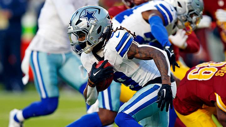 Dallas Cowboys wide receiver KaVontae Turpin breaks a tackle by Washington Commanders safety Jeremy Reaves Dallas Cowboys wide receiver KaVontae Turpin breaks a tackle by Washington Commanders safety Jeremy Reaves