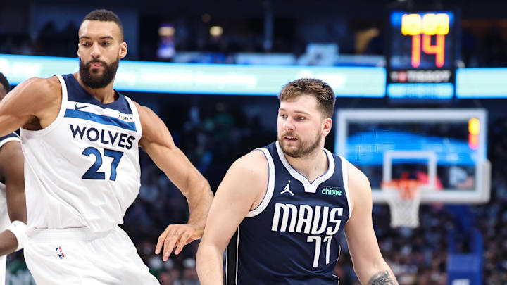 May 28, 2024; Dallas, Texas, USA; Dallas Mavericks guard Luka Doncic (77) dribbles against Minnesota Timberwolves center Rudy Gobert (27) during the third quarter of game four of the western conference finals for the 2024 NBA playoffs at American Airlines Center. Mandatory Credit: Kevin Jairaj-Imagn Images