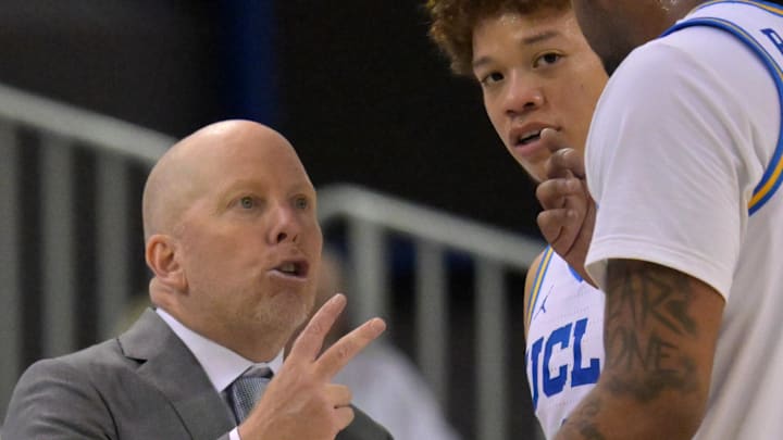 Feb 7, 2026; Los Angeles, California, USA;  UCLA Bruins head coach Mick Cronin talks with guard Trent Perry (0) and guard Brandon Williams (5) in the second half against the Washington Huskies at Pauley Pavilion presented by Wescom Financial. Mandatory Credit: Jayne Kamin-Oncea-Imagn Images
