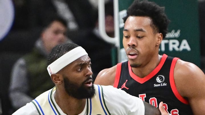 Milwaukee Bucks forward Bobby Portis dribbles against Toronto Raptors guard Scottie Barnes.