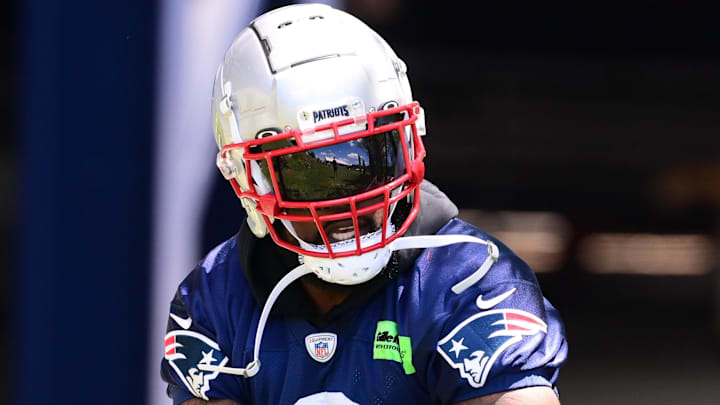 Former New England Patriots linebacker Ja'Whaun Bentley (8) walks to the practice fields for minicamp at Gillette Stadium.