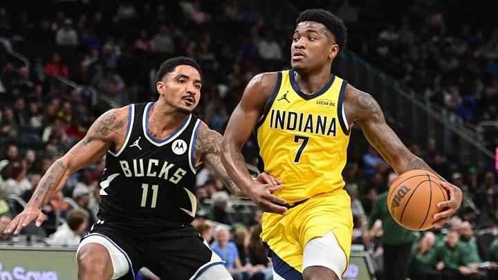 Mar 15, 2026; Milwaukee, Wisconsin, USA; Indiana Pacers guard Kam Jones (7) drives for the basket against Milwaukee Bucks guard Gary Harris (11) in the fourth quarter at Fiserv Forum. Mandatory Credit: Benny Sieu-Imagn Images
