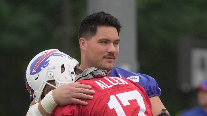 Bills Connor McGovern gives quarterback Josh Allen a hug as part of their ritual greeting during Bills Training Camp at St. John Fisher University on July 30, 2026 in Pittsford.