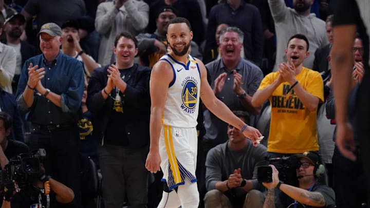 Golden State Warriors guard Stephen Curry (30) smiles after a Warriors basket against the Detroit Pistons in the fourth quarter at Chase Center.