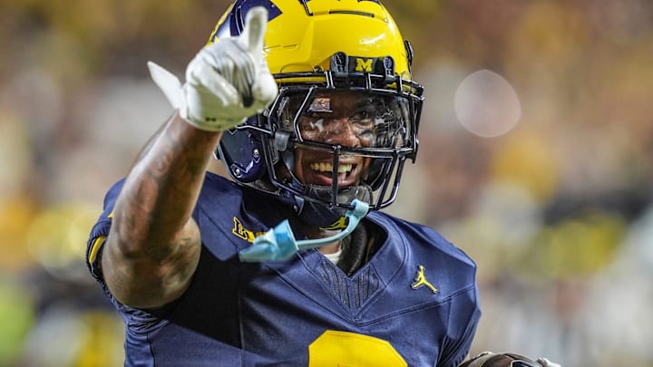 Michigan defensive back Will Johnson (2) celebrates after returning an interception for a touchdown against Fresno State during the second half at Michigan Stadium in Ann Arbor on Saturday, Aug. 31, 2024.