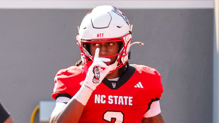 Oct 4, 2025; Raleigh, North Carolina, USA;  NC State Wolfpack running back Hollywood Smothers (3) celebrates a touchdown during the first half of the game against Campbell Fighting Camels at Carter-Finley Stadium. Mandatory Credit: Jaylynn Nash-Imagn Images