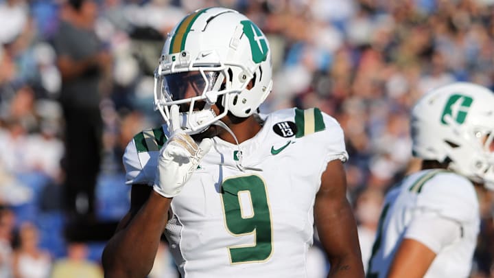 Charlotte 49ers wide receiver O'Mega Blake (9) celebrates after scoring a touchdown during the first half against the Navy Midshipmen at Navy-Marine Corps Memorial Stadium. 