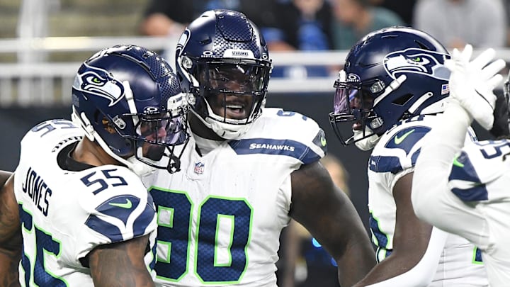 Sep 30, 2024; Detroit, Michigan, USA; Seattle Seahawks defensive tackle Jarran Reed (90) celebrates with teammates after recording a sack against the Detroit Lions in the first quarter at Ford Field.
