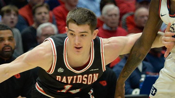 Feb 27, 2024; Dayton, Ohio, USA;  Davidson Wildcats guard Angelo Brizzi (14) battles against Dayton Flyers guard Kobe Elvis (24) during the first half of the game at University of Dayton Arena. Mandatory Credit: Matt Lunsford-USA TODAY Sports