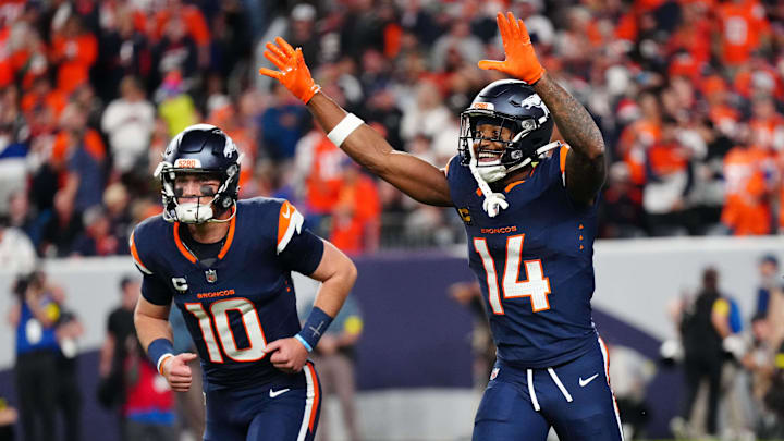 Sep 29, 2025; Denver, Colorado, USA; Denver Broncos wide receiver Courtland Sutton (14) celebrates after scoring a touchdown on a pass from Denver Broncos quarterback Bo Nix (10) during the second quarter against the Cincinnati Bengals at Empower Field at Mile High. 