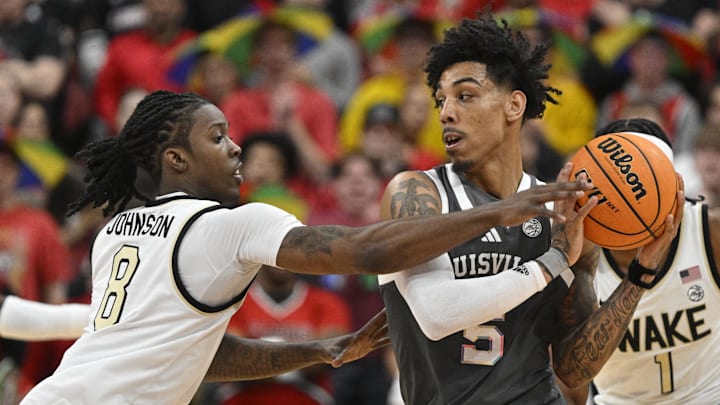 Jan 28, 2025; Louisville, Kentucky, USA;  Wake Forest Demon Deacons guard Ty-Laur Johnson (8) pressures Louisville Cardinals guard Terrence Edwards Jr. (5) during the first half at KFC Yum! Center. Louisville defeated Wake Forest 72-59. 