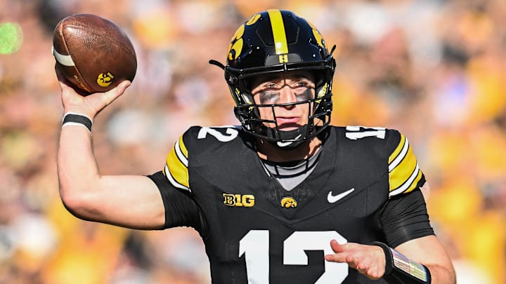 Oct 26, 2024; Iowa City, Iowa, USA; Iowa Hawkeyes quarterback Cade McNamara throws a pass against the Northwestern Wildcats during the first quarter at Kinnick Stadium. Mandatory Credit: Jeffrey Becker-Imagn Images