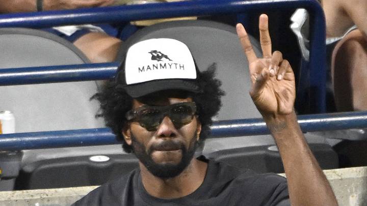 Los Angeles Clippers forward Kawhi Leonard gestures to fans as he is shown on the stadium video screen.