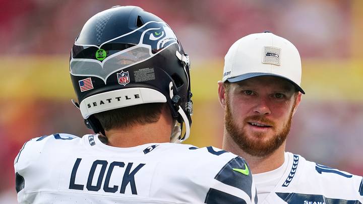 Seattle Seahawks quarterback Sam Darnold talks with quarterback Drew Lock. Seattle Seahawks quarterback Sam Darnold talks with quarterback Drew Lock.