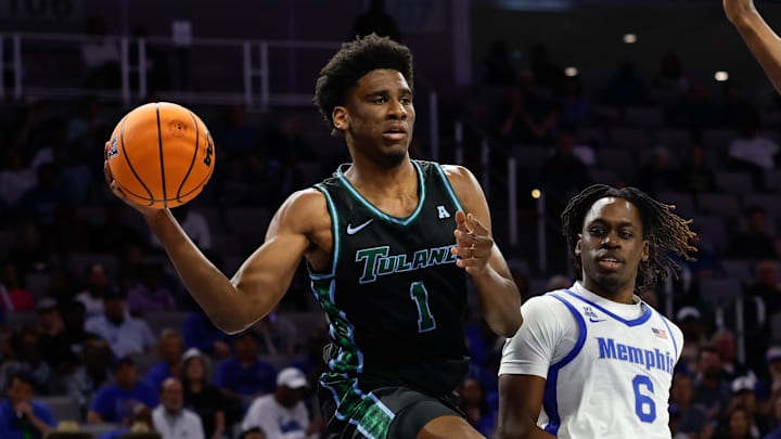 Mar 15, 2025; Fort Worth, TX, USA; Tulane Green Wave forward Kaleb Banks (1) passes the ball ahead of Memphis Tigers guard Baraka Okojie (6) during the first half at Dickies Arena. Mar 15, 2025; Fort Worth, TX, USA; Tulane Green Wave forward Kaleb Banks (1) passes the ball ahead of Memphis Tigers guard Baraka Okojie (6) during the first half at Dickies Arena.