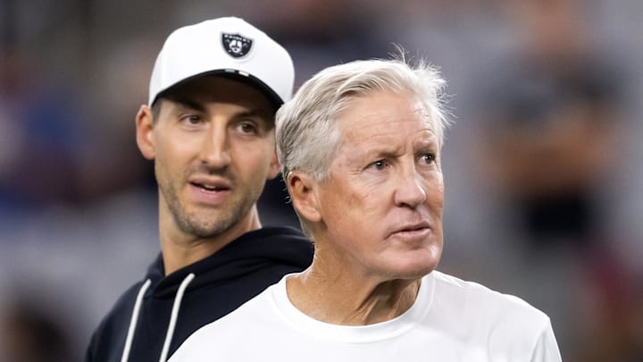 Aug 23, 2025; Glendale, Arizona, USA; Las Vegas Raiders head coach Pete Carroll (right) with son and assistant quarterbacks coach Nate Carroll against the Arizona Cardinals during a preseason NFL game at State Farm Stadium. Mandatory Credit: Mark J. Rebilas-Imagn Images