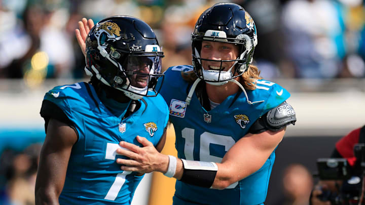 Jacksonville Jaguars quarterback Trevor Lawrence (16) congratulates wide receiver Brian Thomas Jr. (7) on his touchdown score during the third quarter of an NFL football matchup Sunday, Oct. 27, 2024 at EverBank Stadium in Jacksonville, Fla. The Packers edged the Jaguars 30-27 on a last-second field goal. [Corey Perrine/Florida Times-Union]