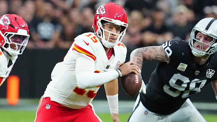 Oct 27, 2024; Paradise, Nevada, USA; Kansas City Chiefs quarterback Patrick Mahomes (15) is flushed out of the pocket by Las Vegas Raiders defensive end Maxx Crosby (98) during the second quarter at Allegiant Stadium. Mandatory Credit: Stephen R. Sylvanie-Imagn Images Oct 27, 2024; Paradise, Nevada, USA; Kansas City Chiefs quarterback Patrick Mahomes (15) is flushed out of the pocket by Las Vegas Raiders defensive end Maxx Crosby (98) during the second quarter at Allegiant Stadium. Mandatory Credit: Stephen R. Sylvanie-Imagn Images