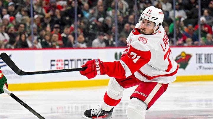 Jan 22, 2026; Saint Paul, Minnesota, USA;  Detroit Red Wings forward Dylan Larkin (71) shoots against the Minnesota Wild during the third period at Grand Casino Arena. Mandatory Credit: Nick Wosika-Imagn Images