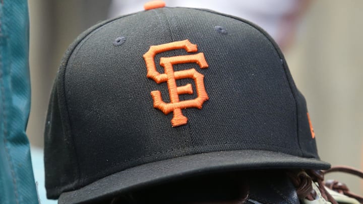 Jul 14, 2023; Pittsburgh, Pennsylvania, USA;  San Francisco Giants hat and glove on the bench against the Pittsburgh Pirates during the first inning at PNC Park. 