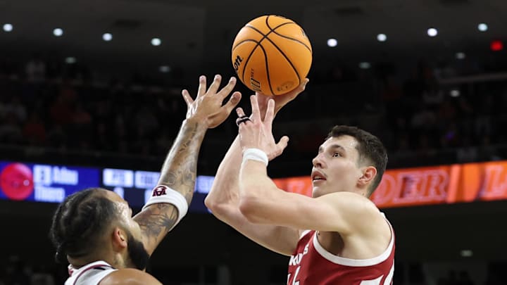 Arkansas Razorbacks forward Zvonimir Ivisic takes his lone shot from 2-point territory over Auburn Tigers forward Johni Broome during the first half at Neville Arena. Ivisic was 0-for-10 from the field, 0-for-9 on 3-pointers.