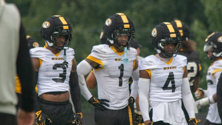 Aug 6, 2025; Columbia, MO, USA; Missouri Tigers safeties Mose Phillips III (3), Marvin Burks Jr. (1) and Caleb Flagg (4) prepare for a defensive drill at a fall camp practice at Mizzou Athletic Training Complex. Aug 6, 2025; Columbia, MO, USA; Missouri Tigers safeties Mose Phillips III (3), Marvin Burks Jr. (1) and Caleb Flagg (4) prepare for a defensive drill at a fall camp practice at Mizzou Athletic Training Complex.