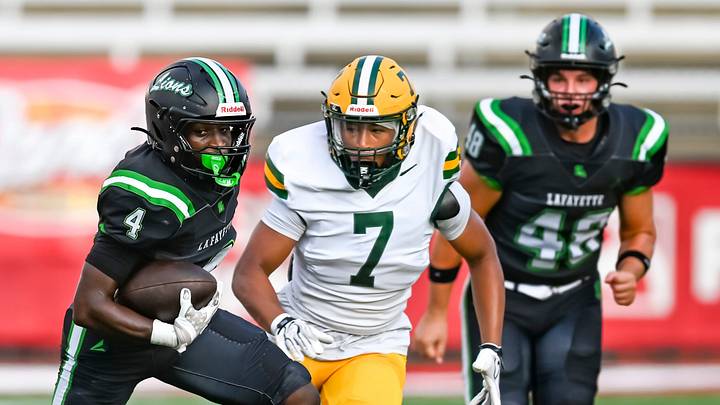 Jaden Celestine runs the ball for Lafayette High in the preseason jamboree against Ceclia.
