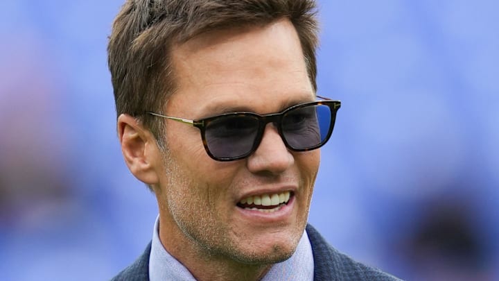 Oct 12, 2025; Baltimore, Maryland, USA; Fox Sports announcer Tom Brady looks on before the game between the Baltimore Ravens and the Los Angeles Rams at M&T Bank Stadium. Mandatory Credit: Mitch Stringer-Imagn Images
