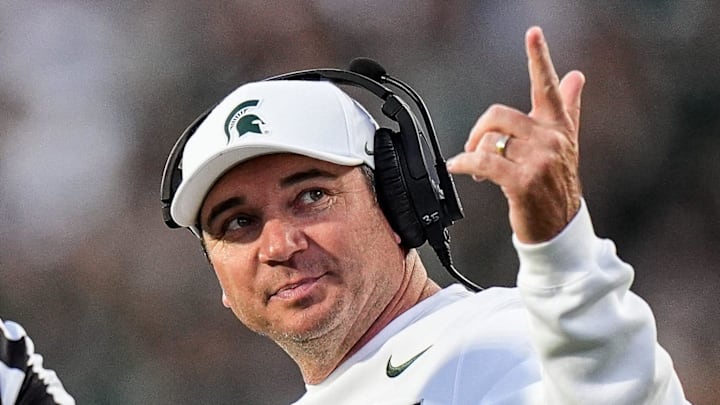 Michigan State head coach Jonathan Smith talks to a referee regarding a call during the first half against Western Michigan at Spartan Stadium in East Lansing on Friday, August 29, 2025.