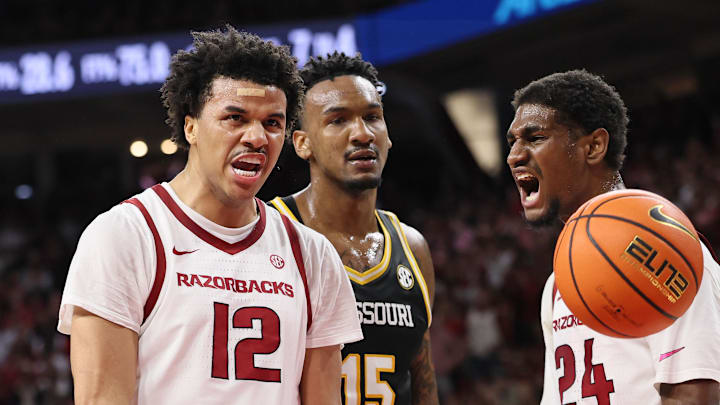Arkansas Razorbacks forward Malique Ewin (12) and wing Billy Richmond III (24) react after a score as Missouri Tigers center Shawn Phillips Jr (15) looks on during the first half at Bud Walton Arena in Fayetteville, Ark. Arkansas Razorbacks forward Malique Ewin (12) and wing Billy Richmond III (24) react after a score as Missouri Tigers center Shawn Phillips Jr (15) looks on during the first half at Bud Walton Arena in Fayetteville, Ark.