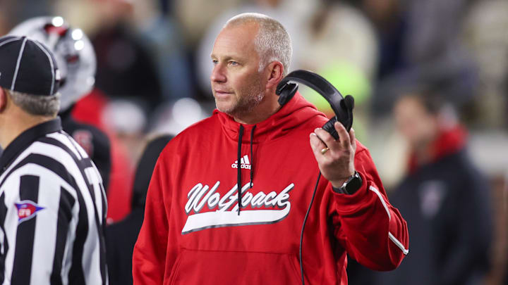 Nov 21, 2024; Atlanta, Georgia, USA; North Carolina State Wolfpack head coach Dave Doeren talks to a referee against the Georgia Tech Yellow Jackets in the fourth quarter at Bobby Dodd Stadium at Hyundai Field. Mandatory Credit: Brett Davis-Imagn Images Nov 21, 2024; Atlanta, Georgia, USA; North Carolina State Wolfpack head coach Dave Doeren talks to a referee against the Georgia Tech Yellow Jackets in the fourth quarter at Bobby Dodd Stadium at Hyundai Field. Mandatory Credit: Brett Davis-Imagn Images