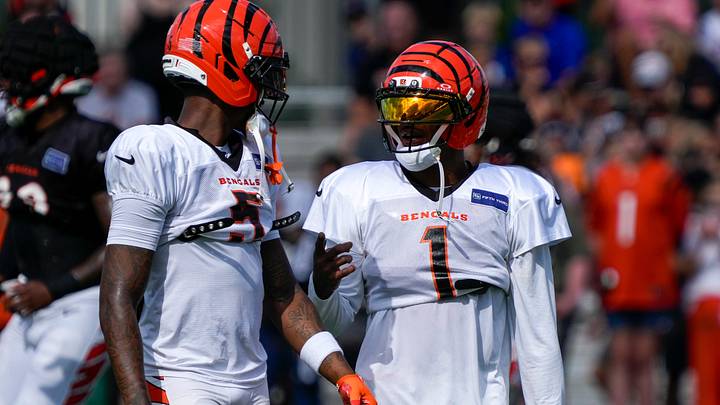 Cincinnati Bengals wide receiver Tee Higgins (5) and wide receiver Ja'marr Chase (1) chat during practice at the Paycor Stadium practice facility in downtown Cincinnati on Monday, Aug. 3, 2026. Cincinnati Bengals wide receiver Tee Higgins (5) and wide receiver Ja'marr Chase (1) chat during practice at the Paycor Stadium practice facility in downtown Cincinnati on Monday, Aug. 3, 2026.