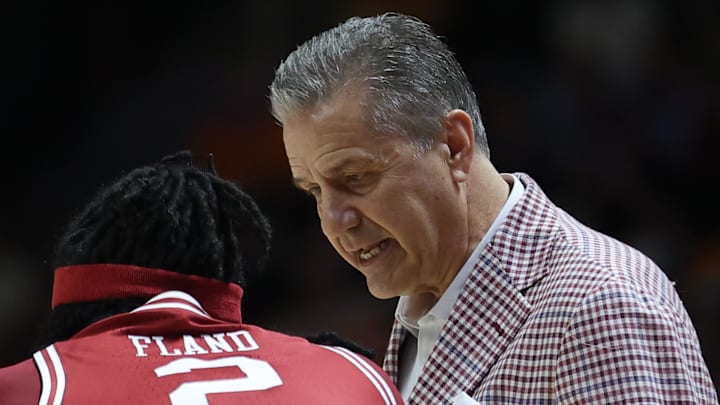 Arkansas Razorbacks coach John Calipari speaks with guard Boogie Fland (2) during the first half against the Tennessee Volunteers at Thompson-Boling Arena at Food City Center.