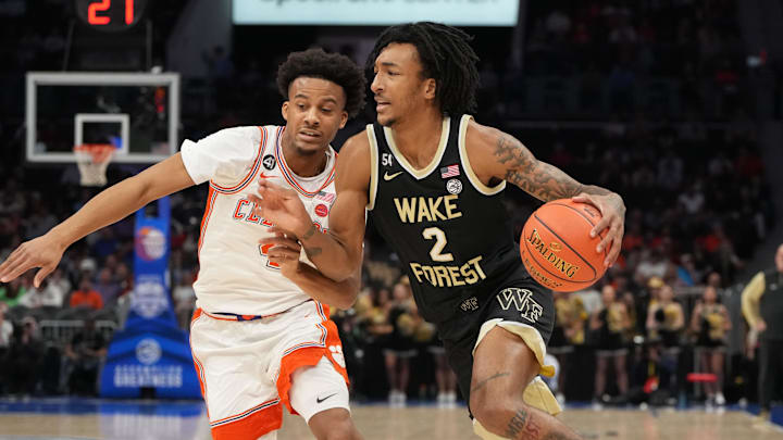 Mar 11, 2026; Charlotte, NC, USA; Wake Forest Demon Deacons forward Juke Harris (2) with the ball as Clemson Tigers guard Efrem Johnson (4) defends in the first half at Spectrum Center. Mandatory Credit: Bob Donnan-Imagn Images