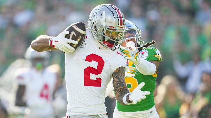 Ohio State Buckeyes wide receiver Emeka Egbuka catches a touchdown in front of Oregon Ducks defensive back Brandon Johnson.