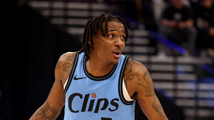 Jan 22, 2025; Inglewood, California, USA; LA Clippers guard Bones Hyland (5) talks to referee Rodney Mott (71) during the second quarter against the Boston Celtics at Intuit Dome. Mandatory Credit: Jason Parkhurst-Imagn Images