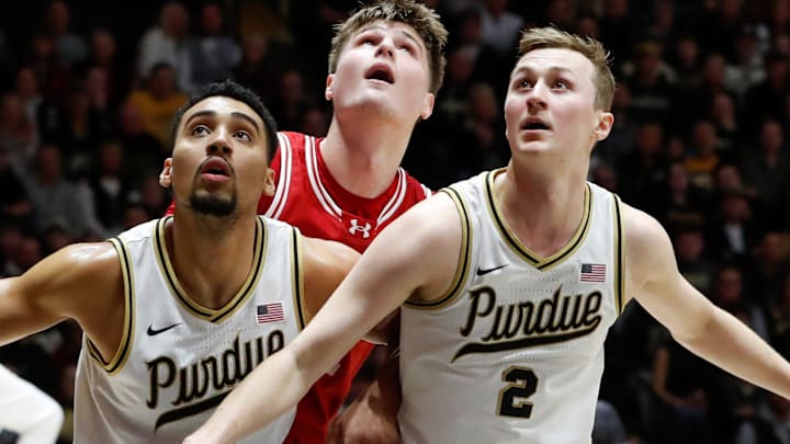 Purdue Boilermakers forward Trey Kaufman-Renn (4) and Purdue Boilermakers guard Fletcher Loyer (2) box out Wisconsin Badgers forward Nolan Winter (31) Saturday, Feb. 15, 2025, during the NCAA men’s basketball game at Mackey Arena in West Lafayette, Ind. Purdue Boilermakers forward Trey Kaufman-Renn (4) and Purdue Boilermakers guard Fletcher Loyer (2) box out Wisconsin Badgers forward Nolan Winter (31) Saturday, Feb. 15, 2025, during the NCAA men’s basketball game at Mackey Arena in West Lafayette, Ind.