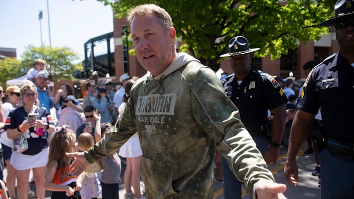 Auburn Tigers head coach Hugh Freeze greets fans during Tiger Walk before Auburn Tigers A-Day football practice at Jordan-Hare Stadium.