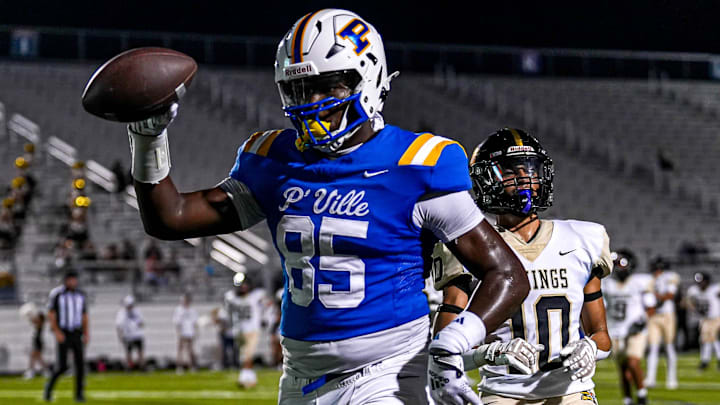 Pflugerville receiver Jaivion Martin (85) runs the ball in for a touchdown during the game against Navarro at The Pfield on Thursday, Sept. 19, 2024 in Pflugerville, Texas.
