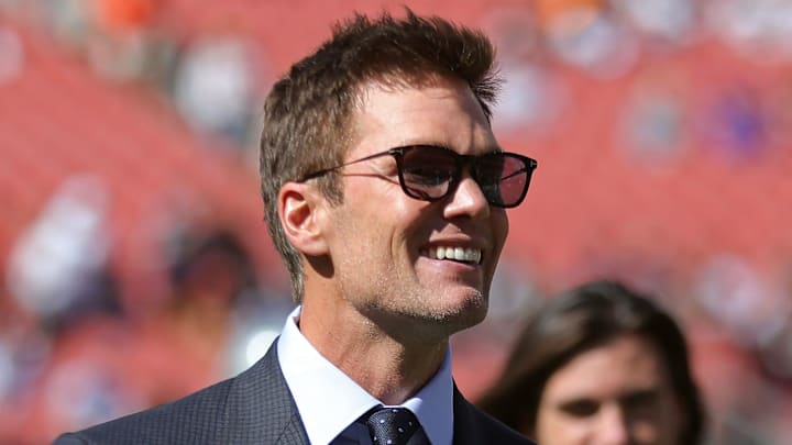NFL legend Tom Brady is all smiles before an NFL football game at Huntington Bank Field, Sunday, Sept. 8, 2024, in Cleveland, Ohio.
